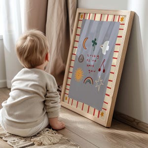 May include: A framed print with a light blue background and colorful illustrations. The text on the print reads "Lucky is to have you".