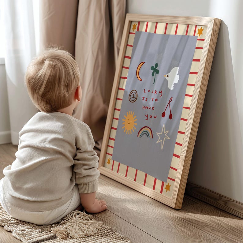 May include: A framed print with a light blue background and colorful illustrations. The text on the print reads "Lucky is to have you".