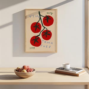 May include: A framed print of a red tomato vine with the text "VINE TOMATOES" and "Italy 1999".