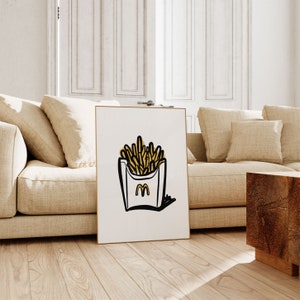 K&ouml;nnte beinhalten: Eine Schwarzwei&szlig;illustration einer Schachtel Pommes Frites mit dem McDonald's-Logo an der Seite. Die Pommes sind gelb und die Schachtel ist wei&szlig; mit schwarzem Umriss. Die Illustration ist auf wei&szlig;em Hintergrund.