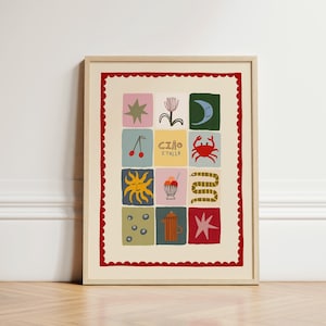 May include: A framed art print with a grid of colourful squares, each with a different illustration. The print includes a star, flower, moon, cherries, crab, sun, ice cream, snake, and the text "Ciao Italia". The frame has a red scalloped border.