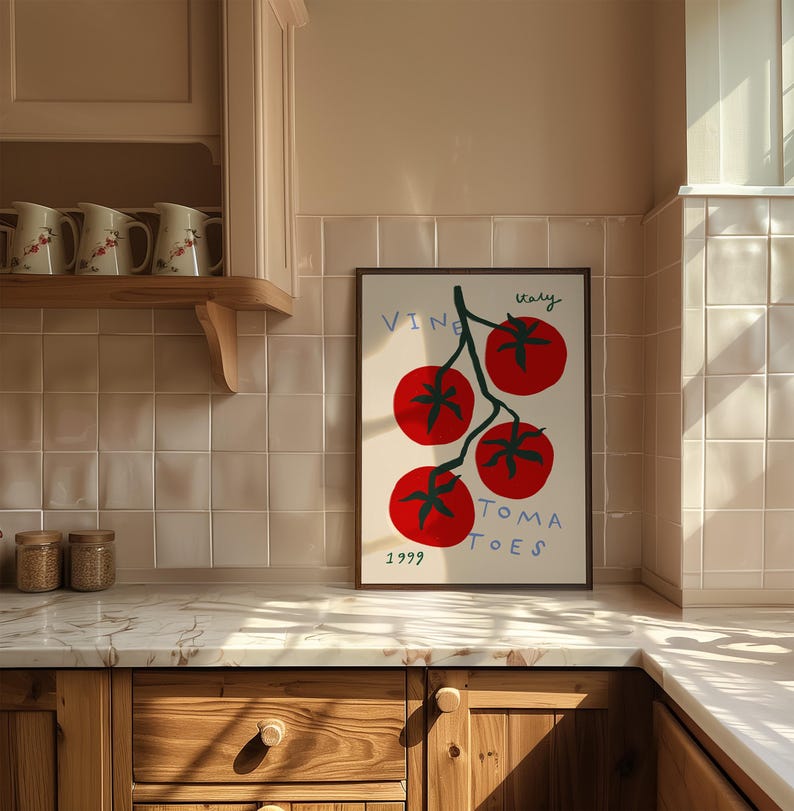 May include: A framed print of a red tomato vine with the text "Italy Vine Tomatoes 1999" in a kitchen setting.