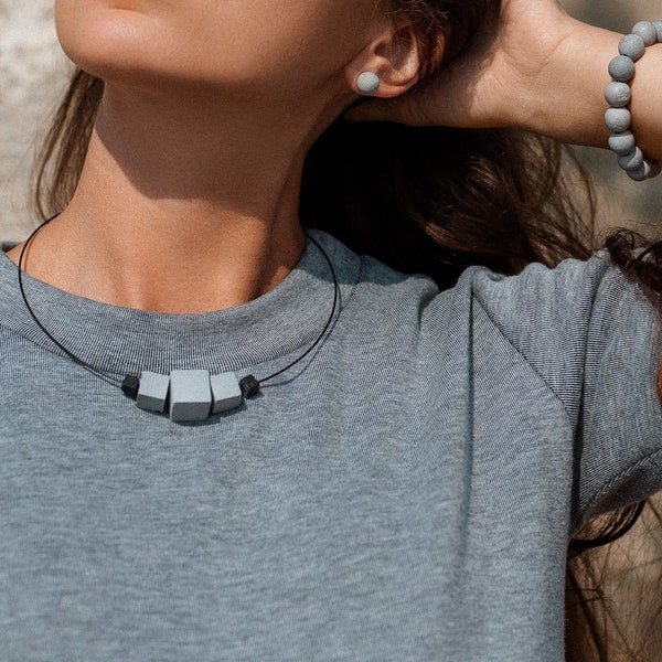 Concrete cube necklace with black Lava stone