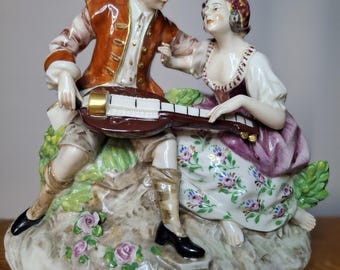 Capodimonte porcelain couple playing instrument