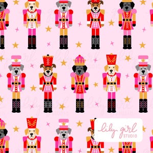 May include: A repeating pattern on a light pink background featuring various dog nutcracker figures wearing red, pink, and gold uniforms with tall hats. Gold stars are scattered between the figures. A white label displays the text lily girl STUDIO.