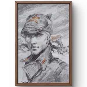 May include: A black and white pencil drawing of a soldier wearing a military cap with a red star. The soldier is looking directly at the viewer with a serious expression. The drawing is framed in a wooden frame.