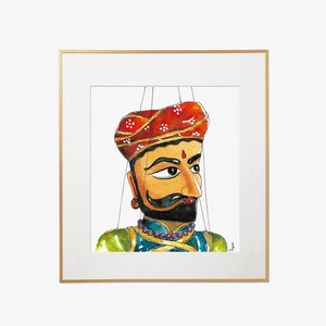Puede incluir: Una pintura de acuarela de un t&iacute;tere con un turbante rojo, una cara amarilla, una barba negra y un traje azul y verde. El t&iacute;tere est&aacute; enmarcado en un marco dorado.