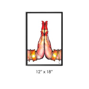 May include: A watercolor painting of two hands in a prayer position, with red nail polish and gold bangles. The hands are depicted against a white background, framed in black.