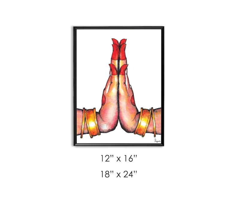 May include: A watercolor painting of two hands in a prayer position, with red nail polish and gold bangles. The hands are against a white background and framed in black.