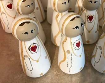 Hand painted wooden peg dolls