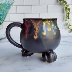 Cauldron Mug - Rainbow Drip on Black Satin Glaze - Handmade Ceramic Pottery - Witch's Cauldron with Paw Feet