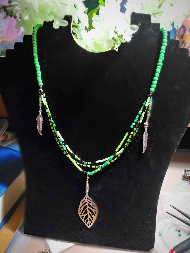 Green glass beaded necklace with silver feathers and leaf charms native american handmade jewelry
