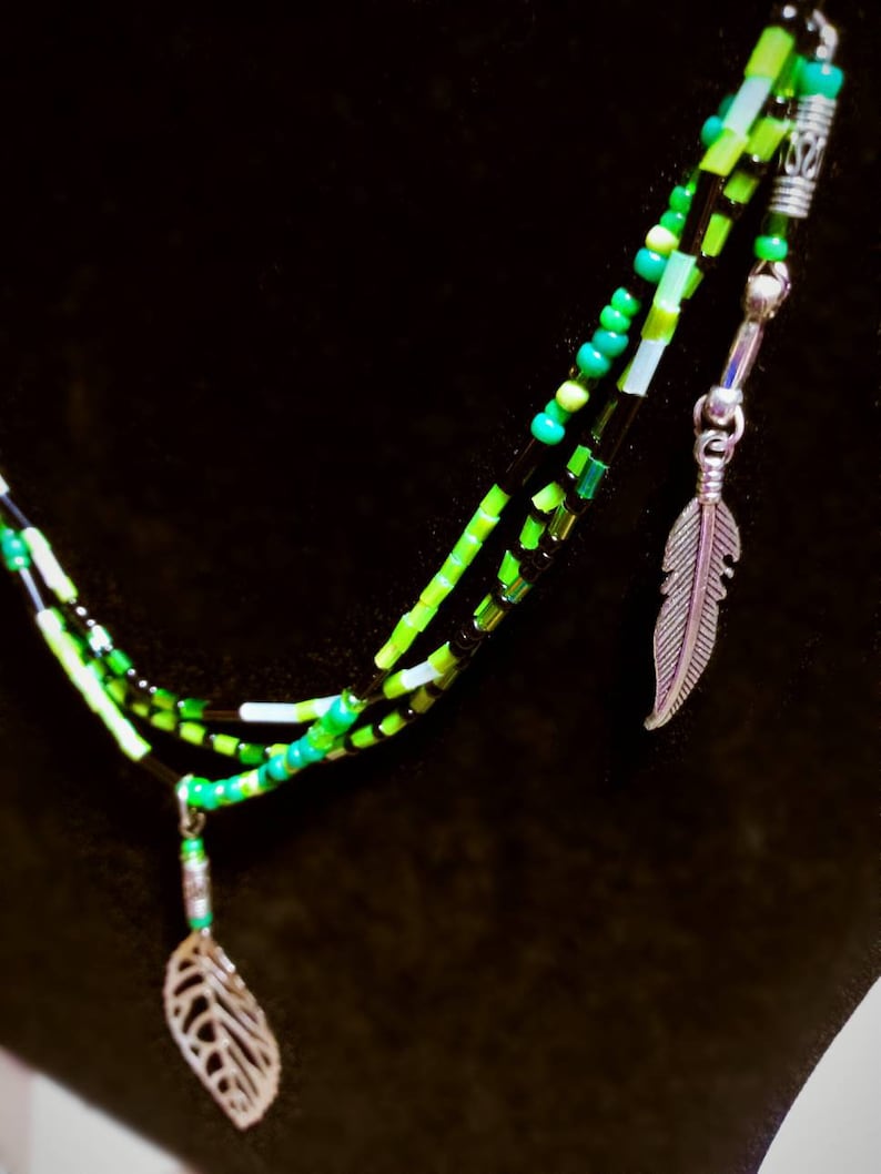 Green glass beaded necklace with silver feathers and leaf charms native american handmade jewelry