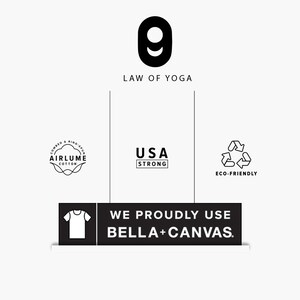 May include: A graphic with the text "LAW OF YOGA" above a stylized number nine. Below are logos for "AIRLUME COTTON", "USA STRONG", and "ECO-FRIENDLY". A black rectangle states "WE PROUDLY USE BELLA+CANVAS."