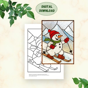 May include: A stained glass panel featuring a snowman skiing down a snowy mountain, wearing a red hat, scarf, and mittens. A black and white coloring page of the same image is next to the panel. The words "DIGITAL DOWNLOAD" are in a green oval.