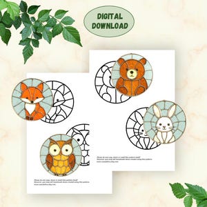 May include: Digital download featuring stained glass animal designs: a fox, bear, owl, and rabbit. Each animal is within a circular frame with a light blue background. The text "DIGITAL DOWNLOAD" is at the top.