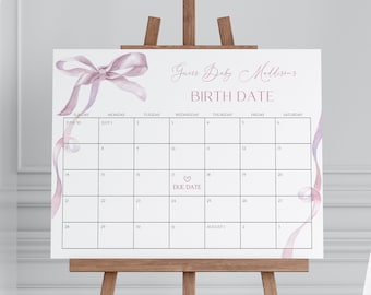 May include: A white calendar with a pink ribbon bow design. The calendar is labelled "Guess Baby Mellisens Birth Date" and has a heart with the words "Due Date" circled on 17th July.