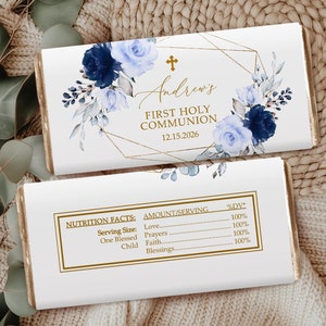 May include: White chocolate bar wrapper with a gold geometric design and blue watercolor floral accents. The text "Andrew's First Holy Communion 12.15.2026" is printed on the wrapper.