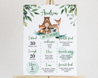 May include: A personalised birthday sign with woodland animals and the name "Andrew." The sign includes details like height (76 cm), weight (9 kg), and favourite things. The design incorporates watercolour leaves and a rustic theme.