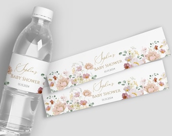 May include: Water bottle labels with a floral design in shades of pink, white, and green. The labels feature the text "Sophia's Baby Shower 01.15.2024" in gold lettering.