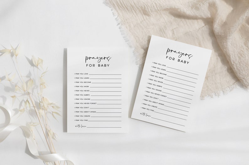 May include: Two white cards with black text that reads "Prayers for Baby". Each card has a list of prayers for a baby, such as "I pray you love", "I pray you learn", and "I pray you know".