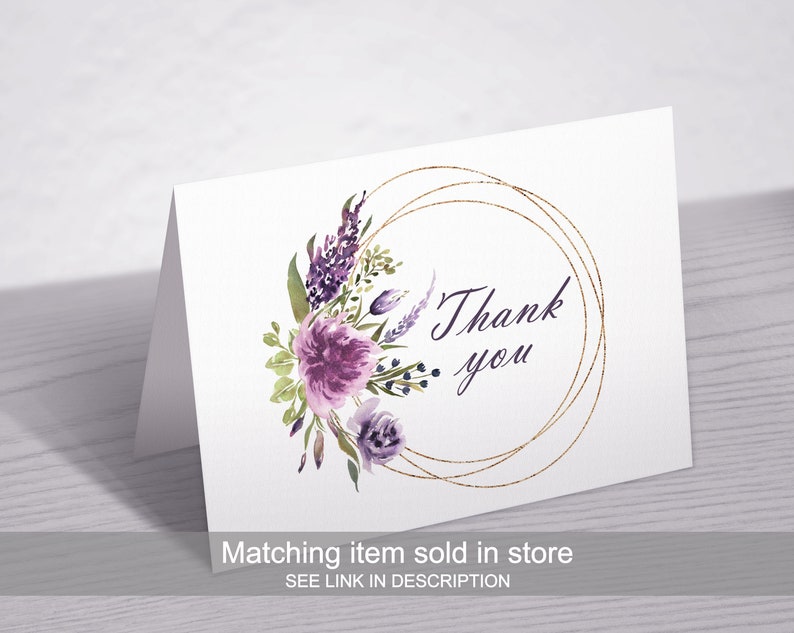 May include: A white card with a gold circle and purple watercolor flowers. The text "Thank you" is inside the circle.