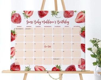 Puede incluir: Un calendario con temática de fresas, con el texto "Guess Baby Maddison's Birthday". La cuadrícula del calendario es de color melocotón claro con un fondo blanco e ilustraciones de fresas. La fecha de vencimiento está marcada el día 17. El calendario se muestra en un caballete de madera.