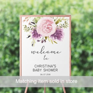 May include: A welcome sign for a baby shower with a watercolor floral design featuring pink and purple flowers. The sign reads "Welcome to Christina's Baby Shower 06.07.2018".