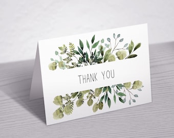 May include: A white card with a green watercolor floral border and the text "THANK YOU" in the center.