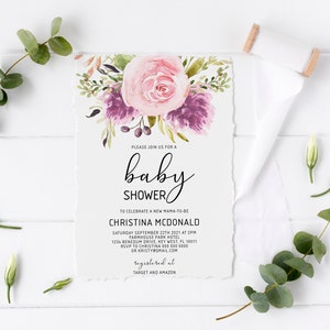 May include: A baby shower invitation with a watercolor floral design featuring pink and purple flowers. The invitation includes the text "Please join us for a baby shower" and the name "Christina McDonald".