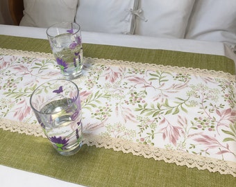 Green table runner with flower decorated with cotton lace