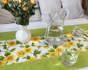 Green table runner with yellow flowers for outdoors or in an entryway