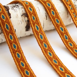 Tablet woven wool trim. Viking reenactment. Yellow, blue and brown.