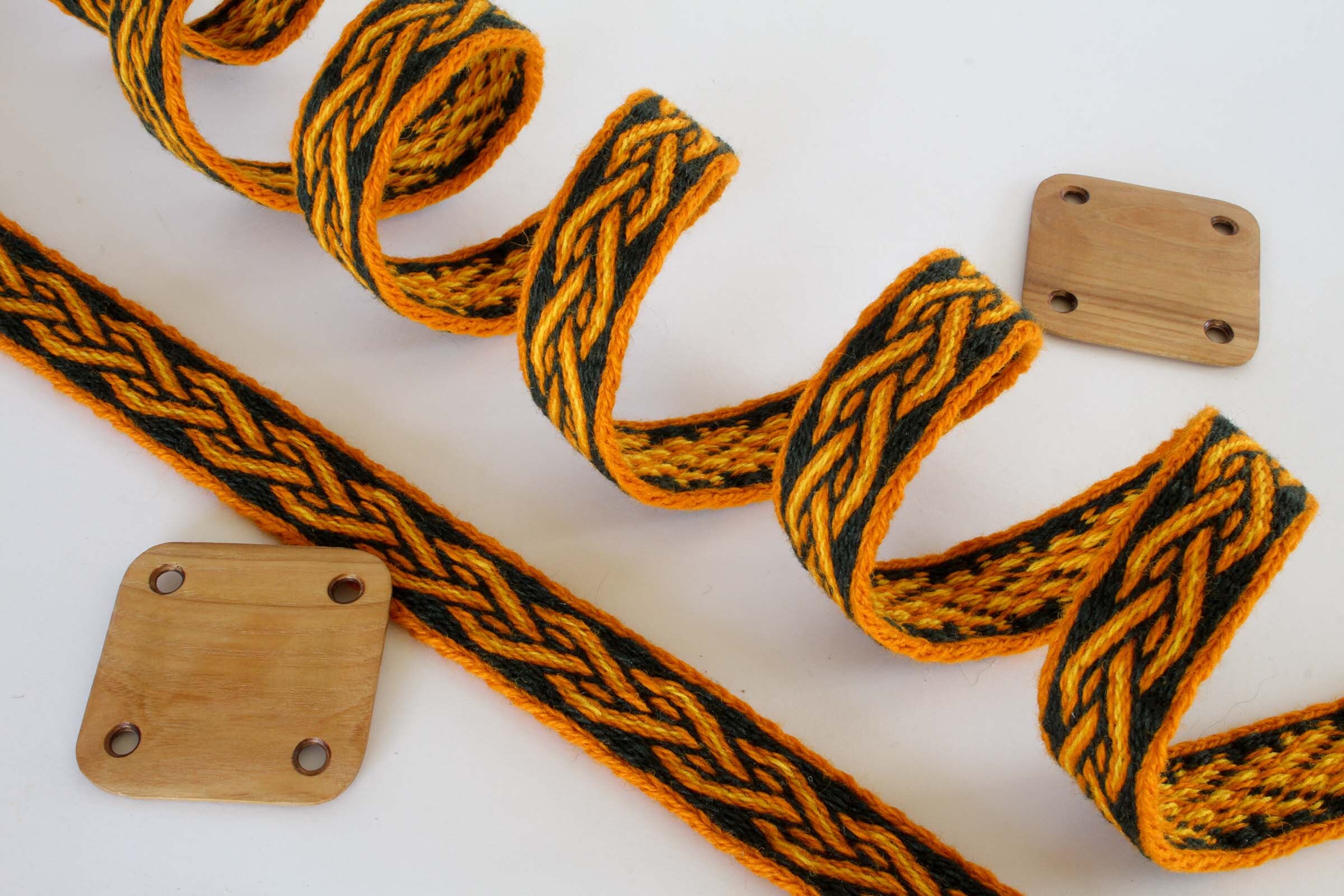 Tablet woven wool trim. Viking reenactment. Orange, black and yellow.