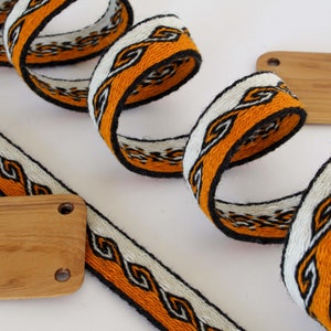 Tablet woven wool trim. Viking reenactment, medieval historical braid. Orange, white and black.