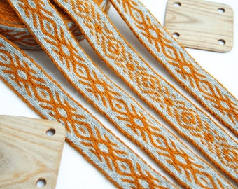 Tablet woven wool trim. Viking reenactment, medieval historical braid. Light gray and orange.