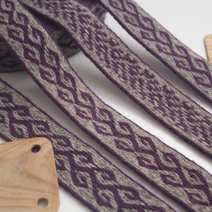Tablet woven wool trim. Viking reenactment, medieval historical braid. Purple and light brown.