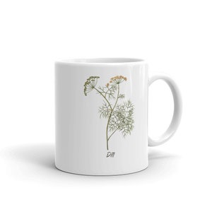 May include: White ceramic mug with a botanical illustration of dill. The design features a detailed drawing of the dill plant with green leaves and yellow-green flowers, with the word "Dill" printed below the illustration.
