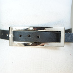 Black belt women with long rectangular buckle