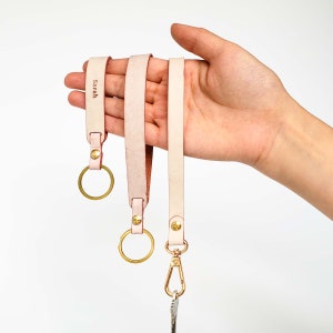 Llavero de cuero rosa con forma de "bucle", llavero de pulsera y llavero con cordón