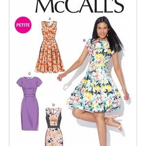 May include: McCall's sewing pattern M7714 featuring four dress designs. The image includes a woman wearing a floral print dress. The pattern includes a petite size option. The McCall's logo is at the top.