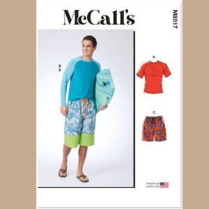 May include: McCall's sewing pattern M8517 for men's swimwear. The pattern includes instructions for a long-sleeved shirt with a color-blocked design, a short-sleeved t-shirt, and a pair of swim trunks.