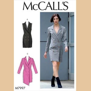 May include: McCall's sewing pattern featuring a woman in a gray double-breasted blazer dress. The pattern includes illustrations of a black sleeveless blazer dress and a pink blazer dress. The pattern number M7997 is visible.