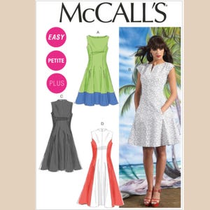 May include: McCall's sewing pattern for a dress with four different styles: A green and blue dress, a gray dress, a red and white dress, and a white dress with a floral print. The pattern includes instructions for easy, petite, and plus sizes.
