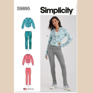 May include: Simplicity sewing pattern number S9895 for a hooded top and trousers. The pattern shows a model wearing a blue and green camouflage print hooded top with a zip and grey trousers. The pattern also shows a pink hooded top and trousers.