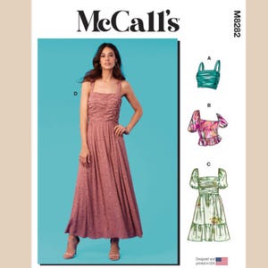 May include: A McCall's sewing pattern featuring a woman in a pink dress with a square neckline and spaghetti straps. The pattern includes options for tops and a dress. The text "McCall's" is at the top.