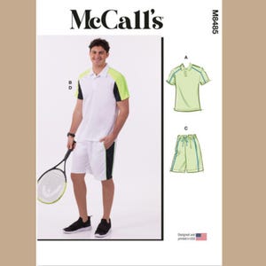 May include: A sewing pattern for a men's athletic outfit. The pattern includes instructions for a white polo shirt with green and black accents, and white shorts with green and black accents. The pattern is from McCall's and the pattern number is M8485.
