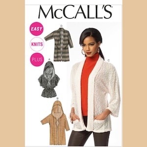 May include: McCall's sewing pattern featuring knit plus-size designs. The image shows a woman wearing a white cardigan with pockets. Other designs include a hooded jacket and a plaid coat. The words "EASY," "KNITS," and "PLUS" are visible.
