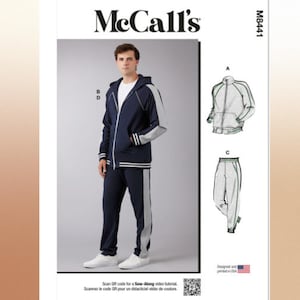 May include: McCall's sewing pattern for a tracksuit. The pattern includes a hooded jacket and pants. The jacket is navy blue with gray accents and white stripes. The pattern is designed and printed in the USA.