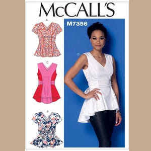 May include: McCall's M7356 sewing pattern featuring a white V-neck top with a peplum and a woman wearing the top. Also shown are three other top designs with floral and color block patterns.